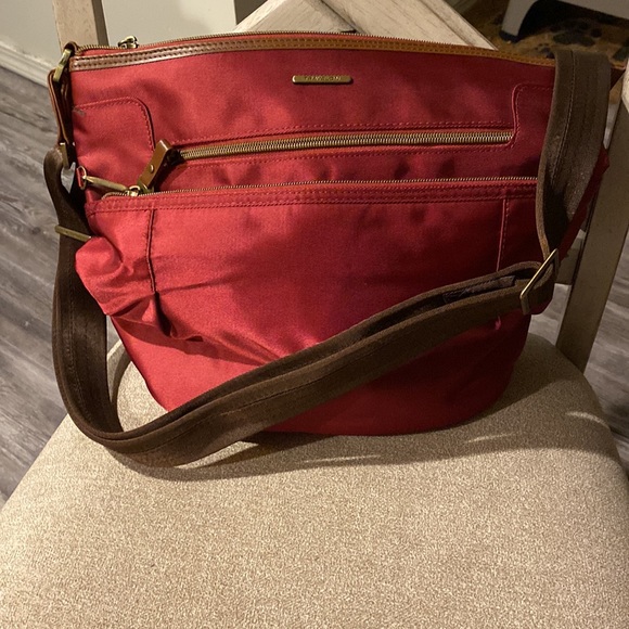 Travelon Handbags - Travelon Anti-Theft RFID Bucket Bag with Leather Trim in Cranberry